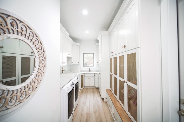 1465 Smith Rd, Lebanon, TN 37087 - kitchen with independent washer and dryer, white cabinetry, recessed lighting, light wood finished floors, and light countertops