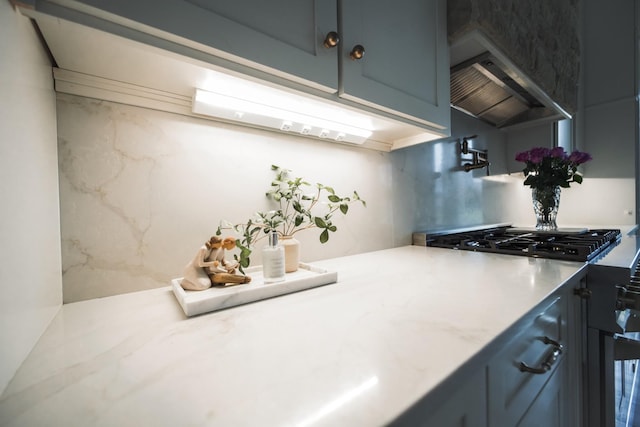 1465 Smith Rd, Lebanon, TN 37087 - kitchen with ventilation hood, light countertops, and backsplash