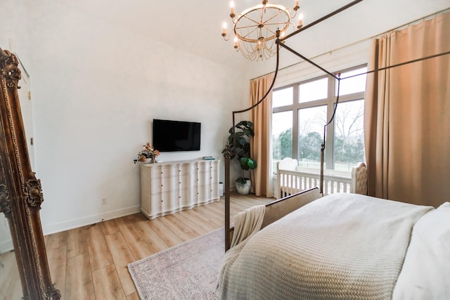 1465 Smith Rd, Lebanon, TN 37087 - bedroom featuring a chandelier, light wood finished floors, a towering ceiling, and baseboards