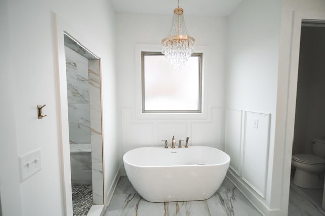 1465 Smith Rd, Lebanon, TN 37087 - full bath featuring marble look tiles, a chandelier, a freestanding bath, toilet, and a marble finish shower