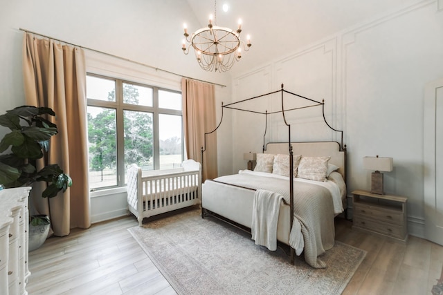 1465 Smith Rd, Lebanon, TN 37087 - bedroom featuring a chandelier, light wood-type flooring, and high vaulted ceiling