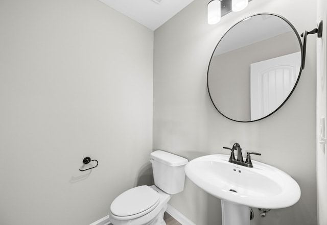 2578 Rafiki Dr, Clarksville, TN 37042 - half bathroom with baseboards, toilet, and a sink