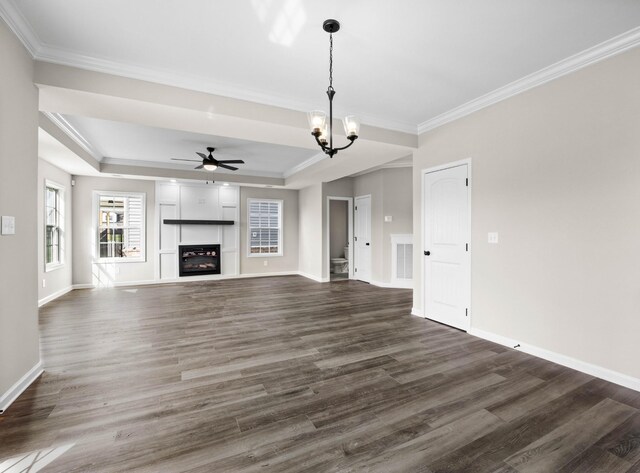 2578 Rafiki Dr, Clarksville, TN 37042 - unfurnished living room featuring dark wood finished floors, a chandelier, crown molding, and baseboards