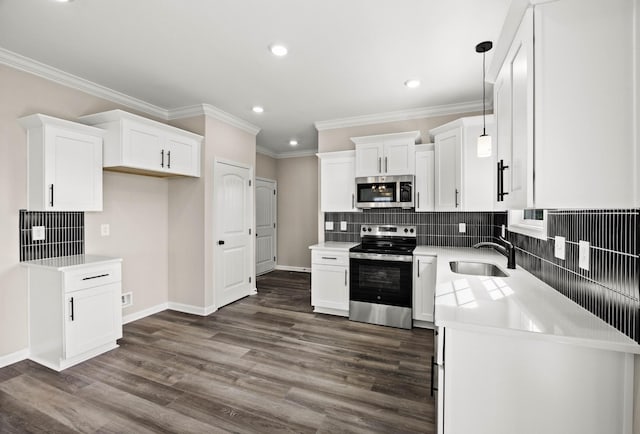 2578 Rafiki Dr, Clarksville, TN 37042 - kitchen featuring stainless steel appliances, a sink, recessed lighting, white cabinetry, and ornamental molding