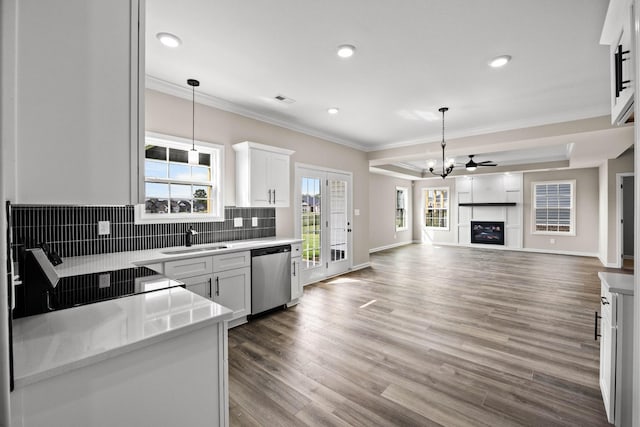 2578 Rafiki Dr, Clarksville, TN 37042 - kitchen with dishwasher, a sink, crown molding, tasteful backsplash, and pendant lighting