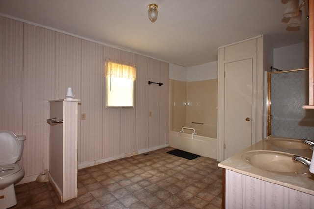 148 W Fourth Ave, Lobelville, TN 37097 - bathroom featuring toilet, washtub / shower combination, double vanity, and baseboards