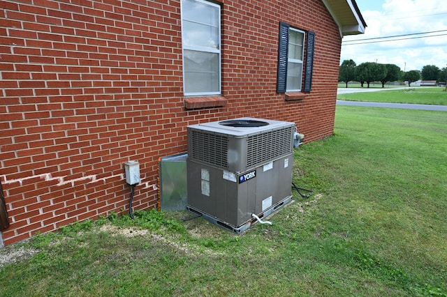 148 W Fourth Ave, Lobelville, TN 37097 - exterior view of central AC unit and brick siding