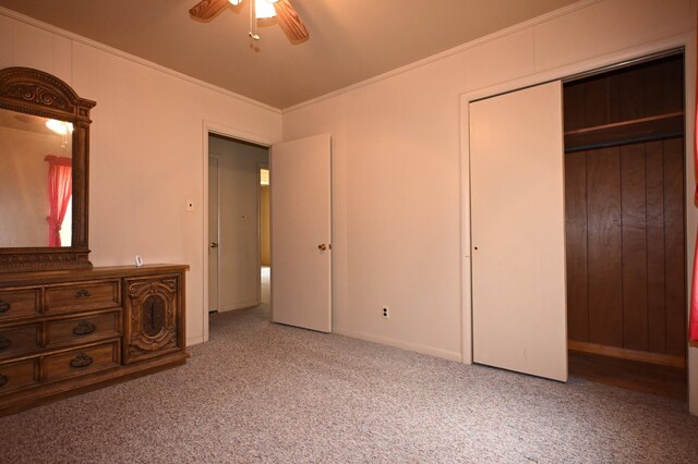 148 W Fourth Ave, Lobelville, TN 37097 - unfurnished bedroom with carpet floors, crown molding, a closet, and a ceiling fan