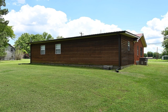 148 W Fourth Ave, Lobelville, TN 37097 - view of home's exterior with cooling unit, a lawn, and crawl space
