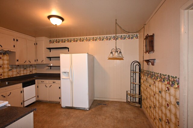 148 W Fourth Ave, Lobelville, TN 37097 - kitchen featuring white appliances, dark countertops, white cabinets, open shelves, and decorative light fixtures