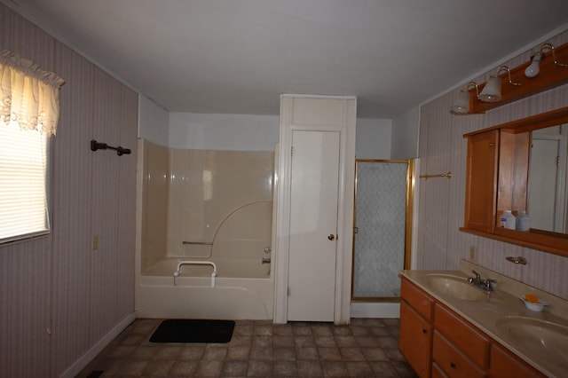 148 W Fourth Ave, Lobelville, TN 37097 - bathroom featuring wallpapered walls, double vanity, enclosed tub / shower combo, and baseboards