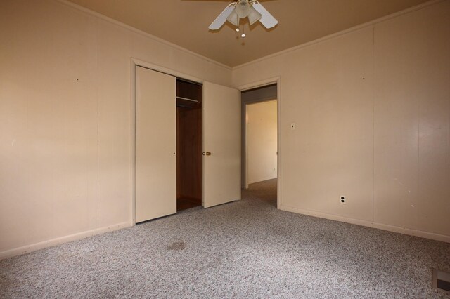 148 W Fourth Ave, Lobelville, TN 37097 - unfurnished bedroom featuring carpet flooring, ornamental molding, a ceiling fan, a closet, and baseboards