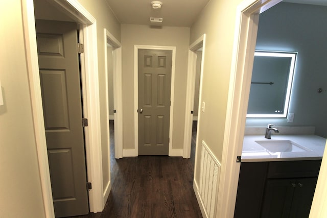 762 Austin Bottom Rd, Baxter, TN 38544 - corridor featuring a sink and dark wood-type flooring