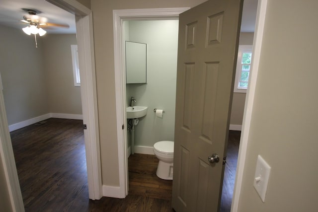 762 Austin Bottom Rd, Baxter, TN 38544 - bathroom with wood finished floors, ceiling fan, toilet, and baseboards