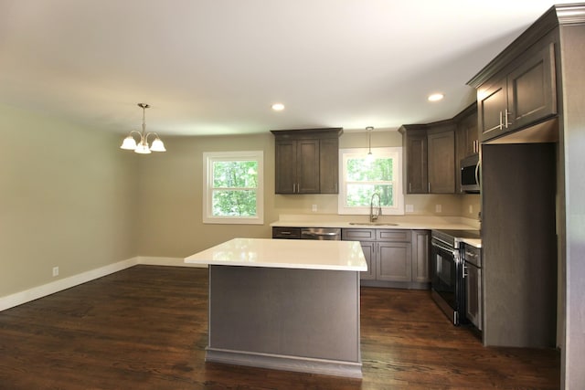 762 Austin Bottom Rd, Baxter, TN 38544 - kitchen featuring appliances with stainless steel finishes, a sink, light countertops, a chandelier, and baseboards