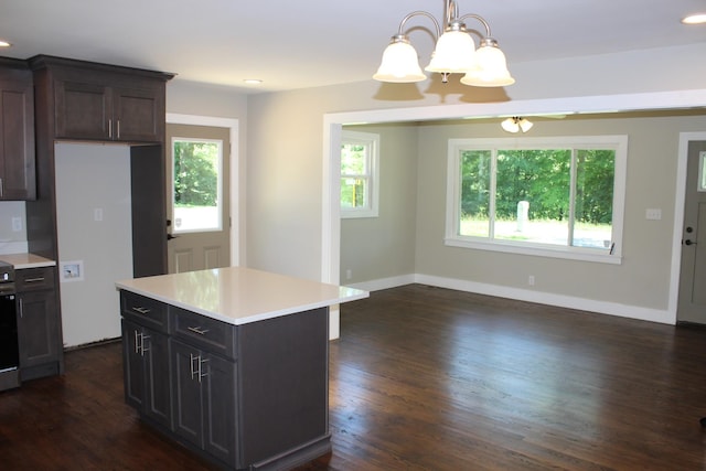 762 Austin Bottom Rd, Baxter, TN 38544 - kitchen with light countertops, dark wood finished floors, a chandelier, decorative light fixtures, and baseboards