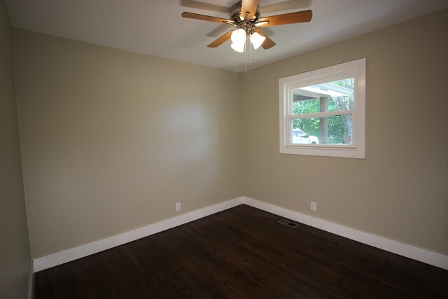 762 Austin Bottom Rd, Baxter, TN 38544 - unfurnished room featuring baseboards, dark wood finished floors, and a ceiling fan