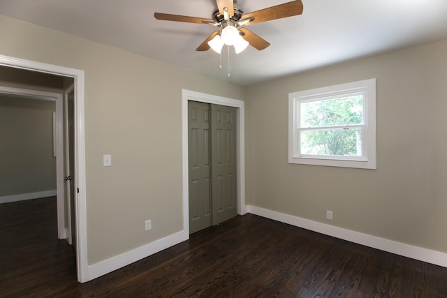 762 Austin Bottom Rd, Baxter, TN 38544 - unfurnished bedroom featuring baseboards, dark wood finished floors, and a closet