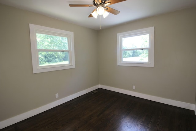 762 Austin Bottom Rd, Baxter, TN 38544 - empty room featuring healthy amount of natural light, baseboards, ceiling fan, and dark wood finished floors