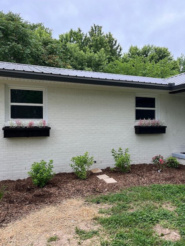 762 Austin Bottom Rd, Baxter, TN 38544 - view of side of home with brick siding and metal roof