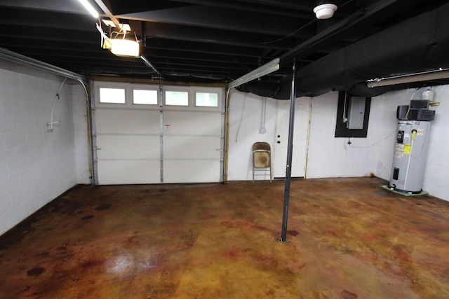 762 Austin Bottom Rd, Baxter, TN 38544 - garage featuring electric water heater, electric panel, a garage door opener, and concrete block wall