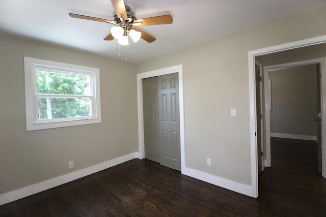 762 Austin Bottom Rd, Baxter, TN 38544 - unfurnished bedroom featuring baseboards, a closet, dark wood-style floors, and ceiling fan