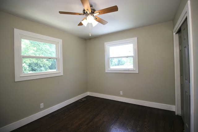 762 Austin Bottom Rd, Baxter, TN 38544 - unfurnished bedroom featuring baseboards, dark wood-style flooring, a closet, and ceiling fan