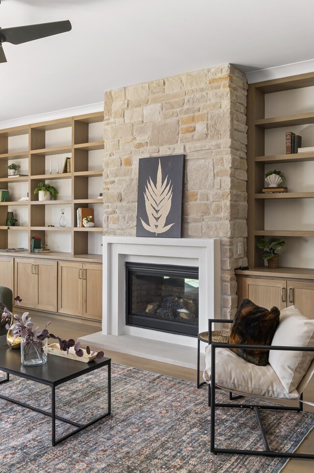 1601 S Observatory Dr Unit C, Nashville, TN 37215 - living room featuring a glass covered fireplace, a ceiling fan, wood finished floors, and built in features