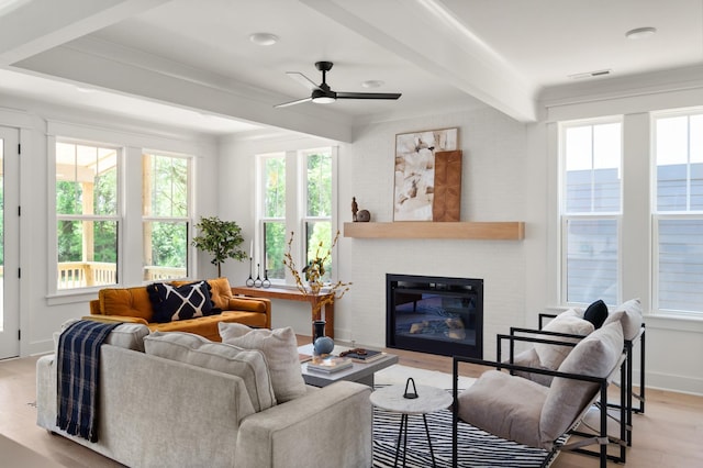 1330 Mcalpine Ave, Nashville, TN 37216 - living room featuring light wood-type flooring, healthy amount of natural light, a ceiling fan, beamed ceiling, and a glass covered fireplace