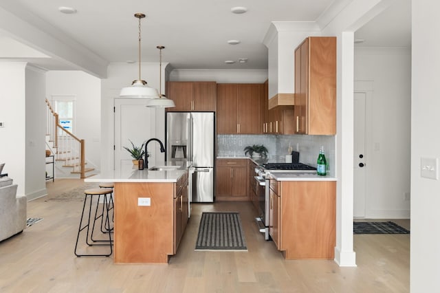 1330 Mcalpine Ave, Nashville, TN 37216 - kitchen with appliances with stainless steel finishes, brown cabinets, light wood finished floors, light countertops, and crown molding