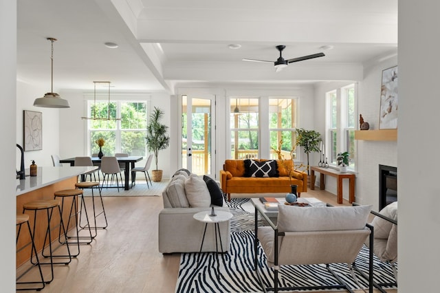 1330 Mcalpine Ave, Nashville, TN 37216 - living area featuring light wood-type flooring, ceiling fan, healthy amount of natural light, a brick fireplace, and ornamental molding