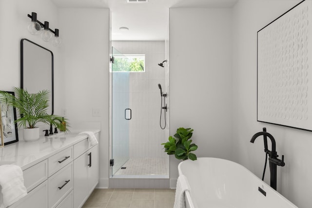 1330 Mcalpine Ave, Nashville, TN 37216 - full bathroom featuring a shower stall, double vanity, a freestanding bath, and tile patterned flooring