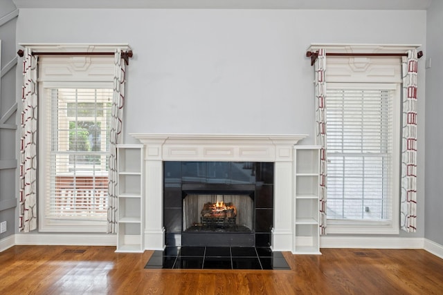 3334 Granite Springs Way, Murfreesboro, TN 37130 - detailed view of wood finished floors, baseboards, and a tiled fireplace