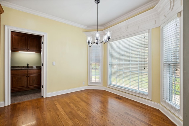 3334 Granite Springs Way, Murfreesboro, TN 37130 - unfurnished dining area featuring a chandelier, wood finished floors, baseboards, and crown molding
