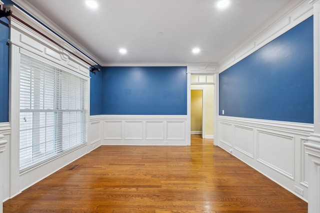 3334 Granite Springs Way, Murfreesboro, TN 37130 - empty room featuring a wainscoted wall, recessed lighting, wood finished floors, a decorative wall, and ornamental molding