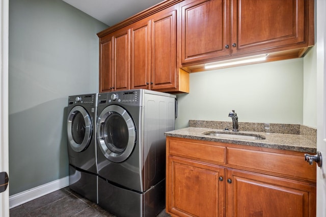 3334 Granite Springs Way, Murfreesboro, TN 37130 - laundry room with cabinet space, separate washer and dryer, dark tile patterned floors, and baseboards