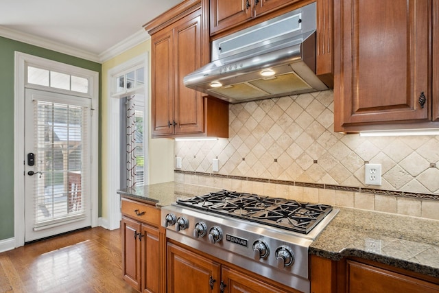 3334 Granite Springs Way, Murfreesboro, TN 37130 - kitchen featuring under cabinet range hood, stainless steel gas cooktop, stone countertops, crown molding, and dark wood finished floors