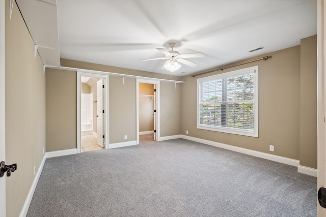 3334 Granite Springs Way, Murfreesboro, TN 37130 - unfurnished bedroom with carpet, baseboards, a walk in closet, connected bathroom, and a ceiling fan