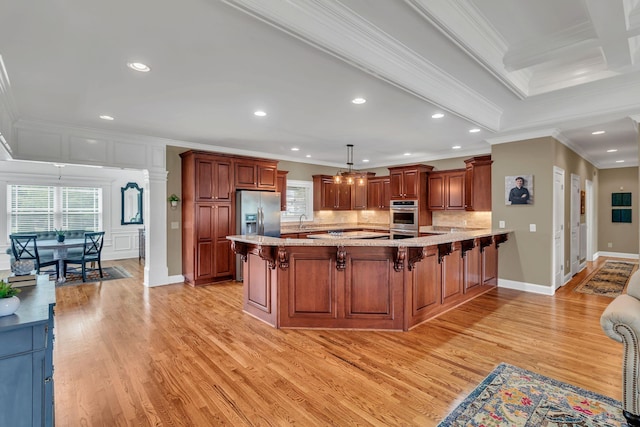 525 Amberly St, Murfreesboro, TN 37129 - kitchen featuring healthy amount of natural light, a breakfast bar area, ornamental molding, light wood finished floors, and appliances with stainless steel finishes
