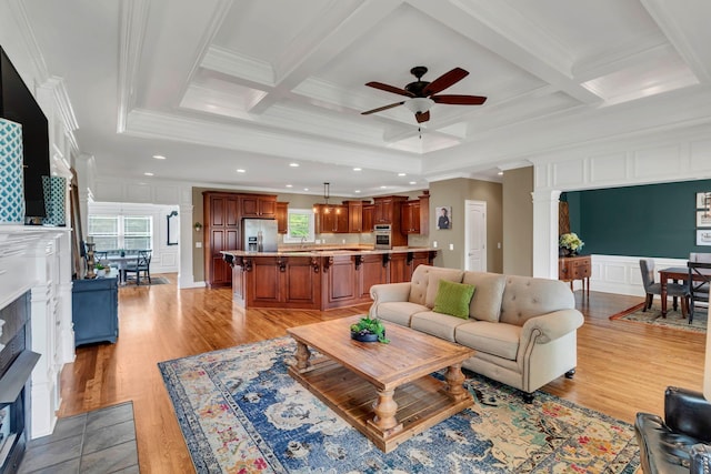 525 Amberly St, Murfreesboro, TN 37129 - living room featuring crown molding, a decorative wall, coffered ceiling, a ceiling fan, and light wood-style flooring