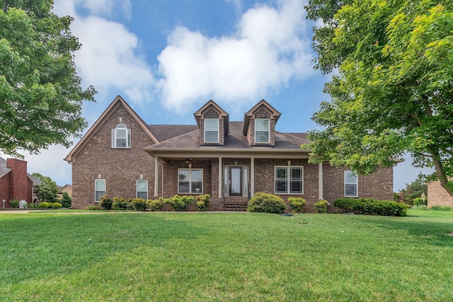 525 Amberly St, Murfreesboro, TN 37129 - view of front of home featuring brick siding, a front yard, and a ceiling fan