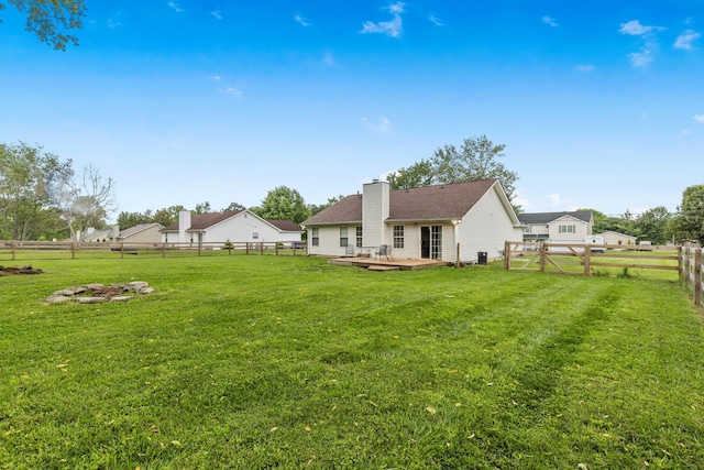 105 Patana Dr, White House, TN 37188 - rear view of house featuring a deck and a chimney