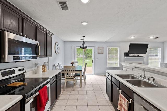 105 Patana Dr, White House, TN 37188 - kitchen with appliances with stainless steel finishes, a sink, light countertops, plenty of natural light, and recessed lighting