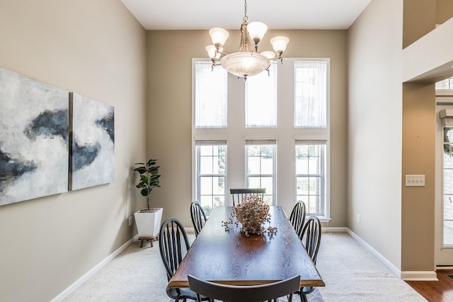 3505 Grove Park Dr, College Grove, TN 37046 - dining space with a chandelier, plenty of natural light, baseboards, and a towering ceiling