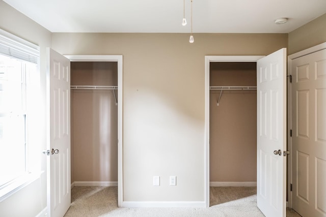 3505 Grove Park Dr, College Grove, TN 37046 - unfurnished bedroom with carpet, two closets, and baseboards