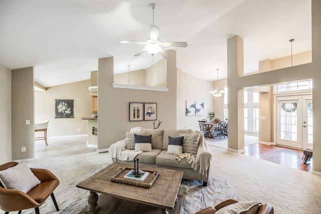 3505 Grove Park Dr, College Grove, TN 37046 - living room with light carpet, high vaulted ceiling, a chandelier, baseboards, and ceiling fan