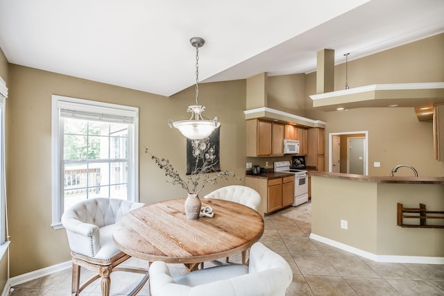 3505 Grove Park Dr, College Grove, TN 37046 - dining space with baseboards, light tile patterned floors, and high vaulted ceiling