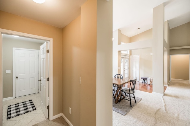 3505 Grove Park Dr, College Grove, TN 37046 - hallway with baseboards, light carpet, and lofted ceiling