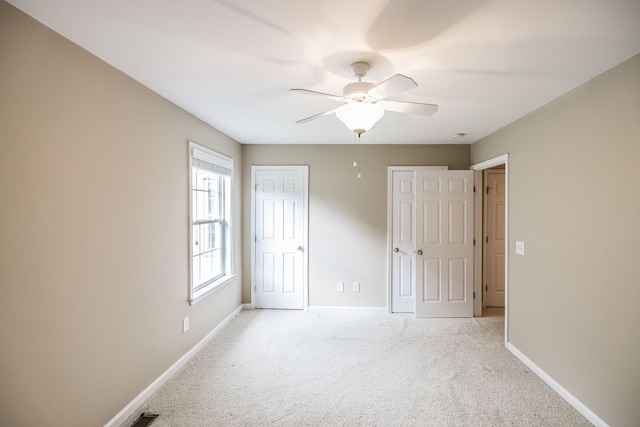 3505 Grove Park Dr, College Grove, TN 37046 - unfurnished bedroom with light carpet, baseboards, and ceiling fan