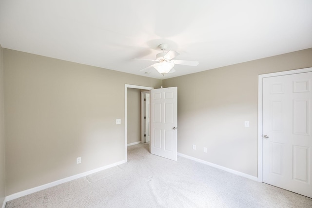 3505 Grove Park Dr, College Grove, TN 37046 - unfurnished bedroom with baseboards, light carpet, and ceiling fan